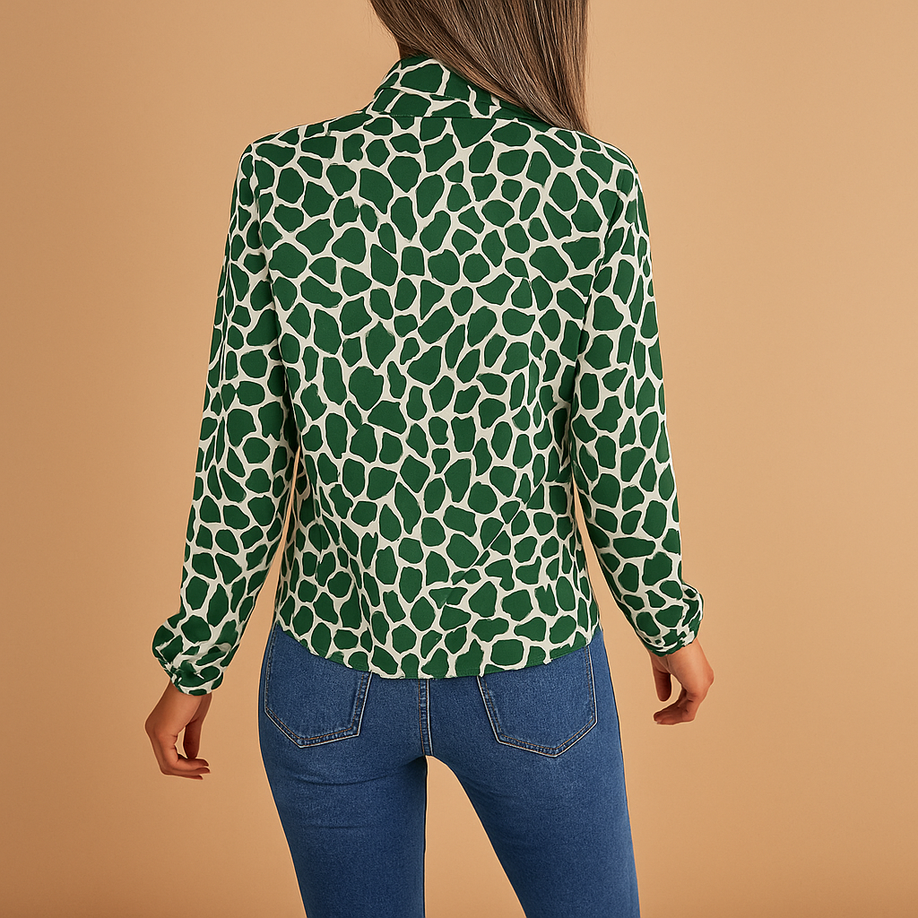 Dames blouse met stippenpatroon, strikdetail en elastische manchetten, geschikt voor zowel zakelijke als casual outfits