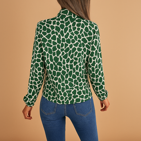 Dames blouse met stippenpatroon, strikdetail en elastische manchetten, geschikt voor zowel zakelijke als casual outfits