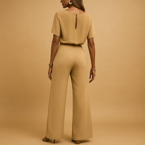 Chique dames jumpsuit in zwart, beige of groen met getailleerde pasvorm en losvallende mouwen, ideaal voor formele en stijlvolle gelegenheden.