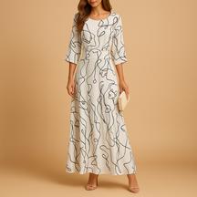 Dames zomerjurk met opvallend ontwerp en elegante pasvorm, perfect voor brunches, tuinfeesten en zomerse avonden.