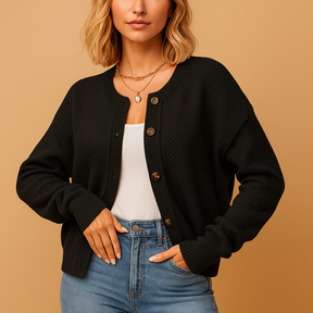 Lange damestrui met col en decoratieve knopen, ideaal voor stijlvolle laagjes en winterse dagen.