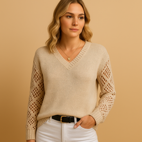 Gebreide damestrui met opengewerkt patroon, losse pasvorm en ademend materiaal. Perfect voor casual outfits en seizoenslayering.