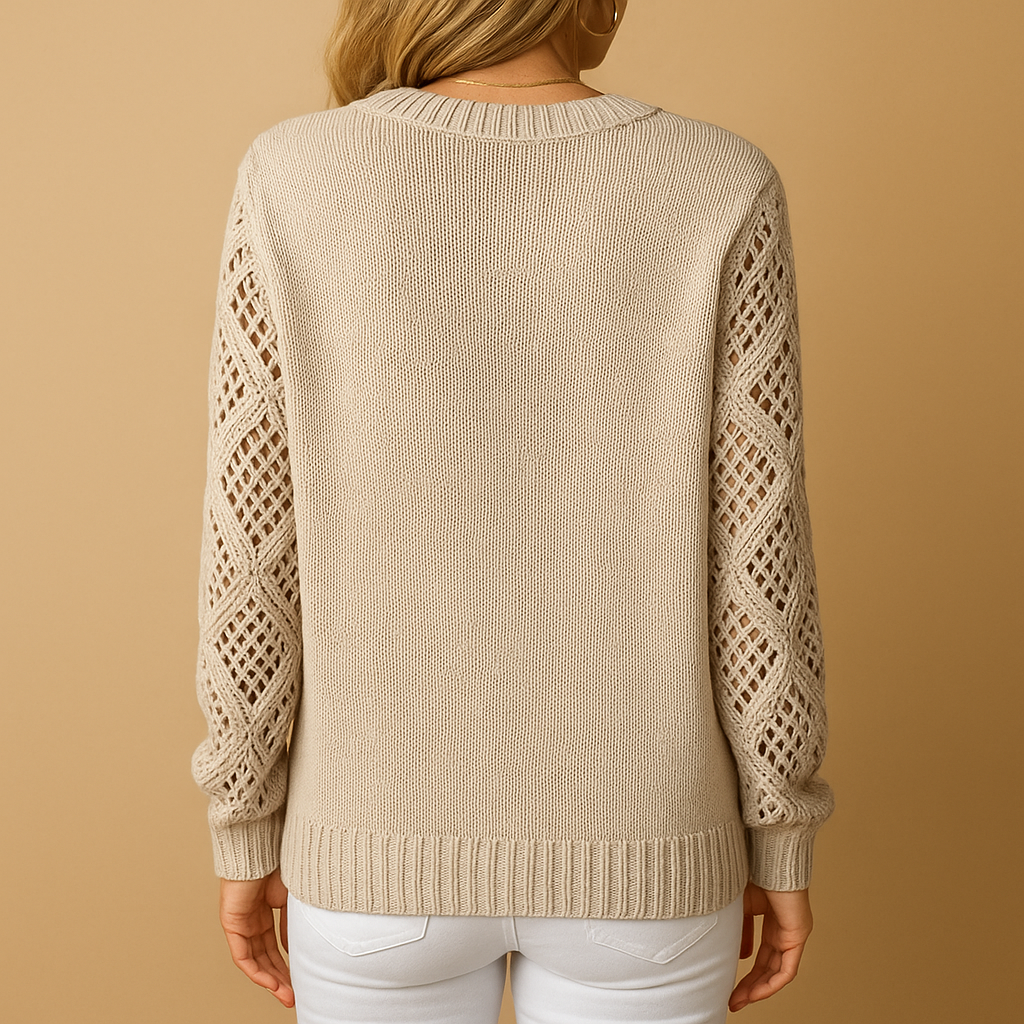 Gebreide damestrui met opengewerkt patroon, losse pasvorm en ademend materiaal. Perfect voor casual outfits en seizoenslayering.