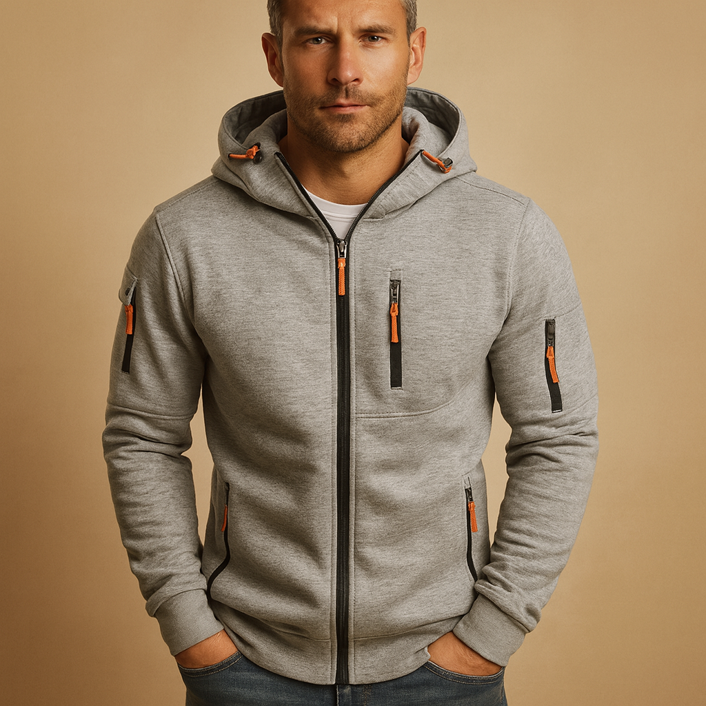 Heren hoodie met rits en capuchon, verkrijgbaar in meerdere kleuren. Comfortabel en veelzijdig voor casual en sportieve outfits in de herfst en winter.