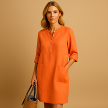 Casual dames tuniekjurk met knopen, zakken en opgerolde mouwen – ideaal voor dagelijks comfort en ontspannen stijl.