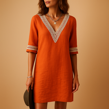 Lichte zomerjurk voor dames met V-hals en kanten details, perfect voor stranddagen en casual zomerlooks.